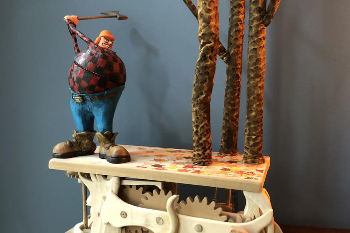 Artist Don Becker creates automatons after being laid off from his job during the pandemic. This mechanical sculpture features a woodcutter being thwarted by trees.