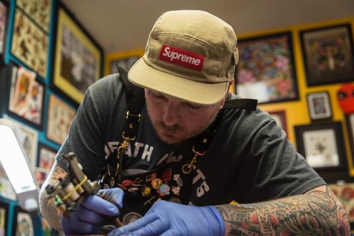Billy White, owner of Red Rose Tattoo in Zanesville, Ohio, will cover up people's previous racist tattoos. But first he ensures it reflects a genuine change in ideology. He's seen more interest in covering up tattoos this year than before.