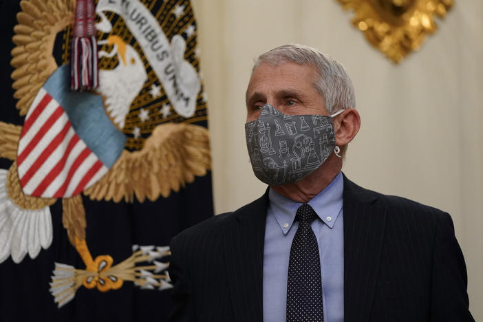 Dr. Anthony Fauci, director of the National Institute of Allergy and Infectious Diseases, arrives for an event on the coronavirus with President Biden at the White House on Thursday.