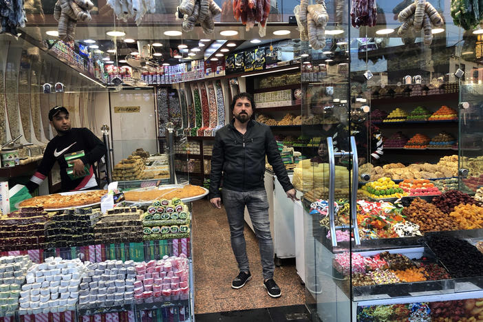 "Now, because of the rise of the dollar and the pensions people aren't receiving, there are two classes of people," says Saad Salman, the owner of a Baghdad sweet shop. "A poor class and a rich class."