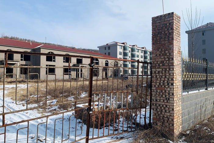 According to Zhang Zhixiong's family, Juxin Mining Co. paid for several village infrastructure projects, including building new apartment complexes for local residents. The buildings were weeks away from completion before Zhang was arrested and now stand abandoned in the middle of the village.
