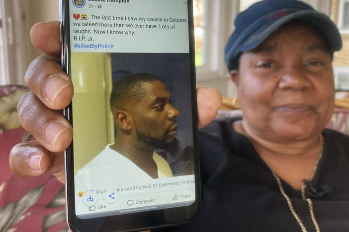 Andrew Brown Jr. was shot in the back of his head, his family's attorneys said Tuesday, citing an independent autopsy. Here, Glenda Brown Thomas displays a photo of Brown, her nephew, on her cellphone at her home in Elizabeth City, N.C.