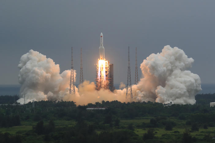 in this April 29, 2021, file photo released by China's Xinhua News Agency, a Long March 5B rocket carrying a module for a Chinese space station lifts off from the Wenchang Spacecraft Launch Site in Wenchang in southern China's Hainan Province.