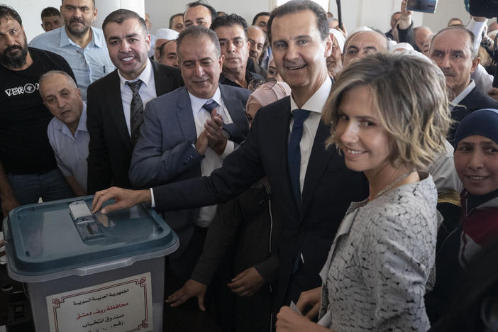 Syrian President Bashar Assad and his wife, Asma, vote at a polling station during the presidential election Wednesday in Douma, near the Syrian capital of Damascus.