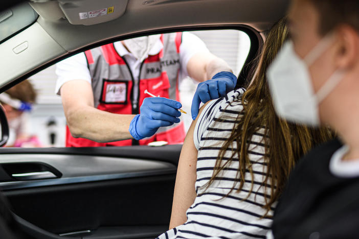 A woman receives the Johnson & Johnson COVID-19 at a drive-in vaccination event last week in Meerbusch, Germany.