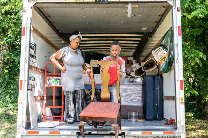 Tasharn Richardson's 11-year-old son, Lionel, helps unload the moving truck at their new home in Washington, D.C. To Tasharn, having a house to call her own always seemed like someone else's dream.