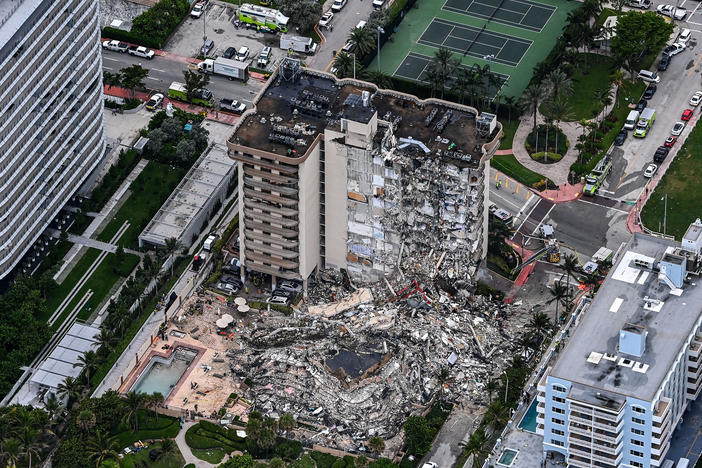An aerial view shows search and rescue personnel working on site after the partial collapse of the Champlain Towers South in Surfside, north of Miami Beach, on Thursday.