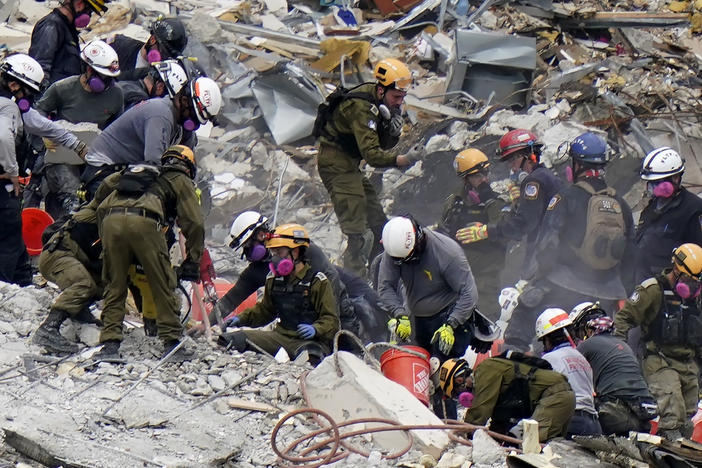 Crews from the United States and Israel work in the rubble of Champlain Towers South condo in Surfside, Fla.