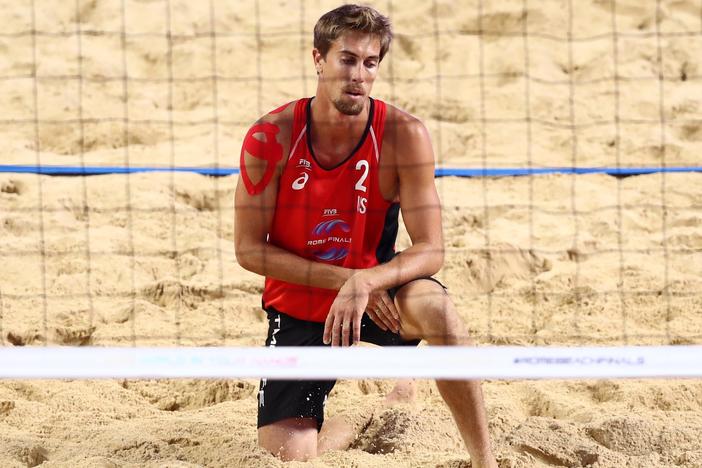 Taylor Crabb, shown here during a 2019 beach volleyball match, tested positive upon arrival to Tokyo and was not able to compete at the Olympic Games.