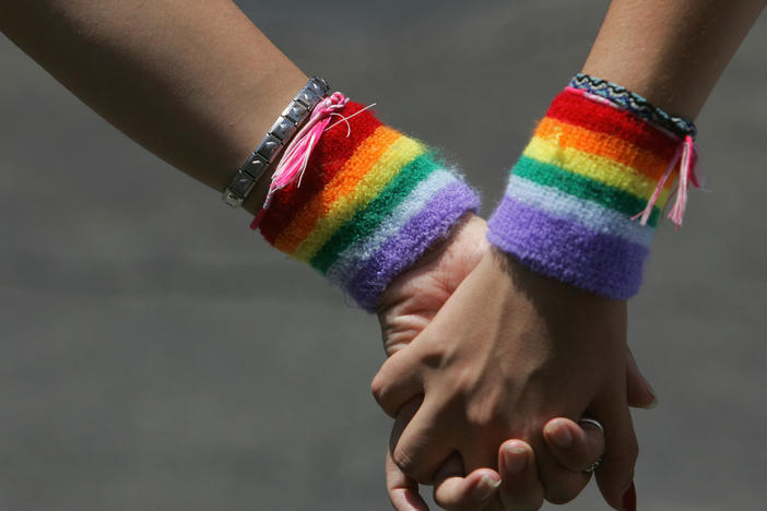 A lesbian couple hold hands during the annual Gay Pride rally, on June 8, 2007. Recent survey data shows that LGBTQ adults in the U.S. are more likely to report higher rates of food and economic insecurity.