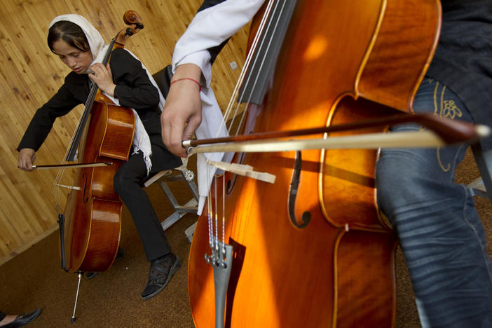 Students practice the cello during class at the Afghanistan National Institute of Music on Sept. 26, 2010 in Kabul.