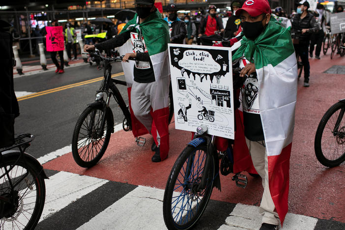 Food delivery riders take part in a street protest ride organized by the group "Los Deliveristas Unidos" demanding better working conditions, pay and protections in Times Square in Manhattan in New York City, New York, U.S., April 21, 2021.