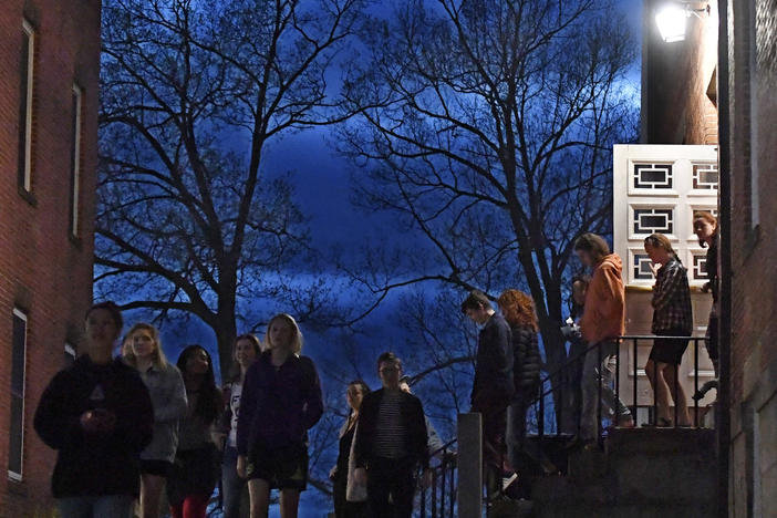 Students walk out of Johnson Chapel at Amherst College in Amherst, Mass., April 24, 2019. Amherst College will no longer give admissions preference to the children of alumni, the school announced Wednesday.