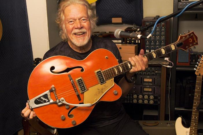 Randy Bachman holds a Gretsch guitar that is similar to the one stolen in 1976. He plans to swap this one for his original with TAKESHI, a Japanese musician who bought Bachman's beloved instrument in 2016.