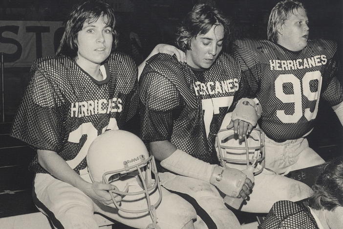 Brenda Cook, Brant Hopkins and Baby Murf of the the National Women's Football League team the Houston Herricanes.