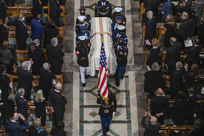 Members of the Honor Guard carry the casket of former Secretary of State Colin Powell at National Cathedral in Washington, D.C.