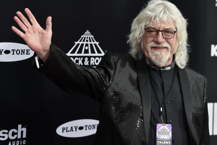 Graeme Edge, drummer for The Moody Blues, waves on the red carpet before the Rock & Roll Hall of Fame induction ceremony April 14, 2018, in Cleveland. The band's frontman, Justin Hayward, confirmed Edge's death Thursday, on the group's website.