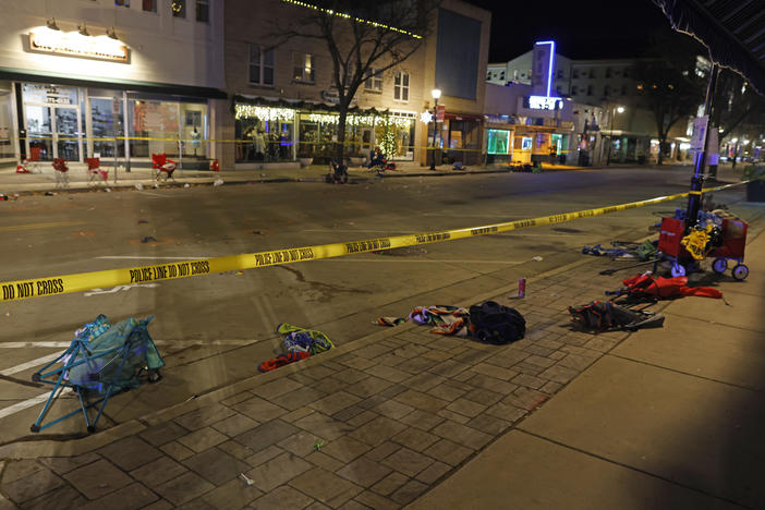 Police tape cordons off a street in Waukesha, Wis., after an SUV plowed into a Christmas parade, hitting multiple people on Sunday.