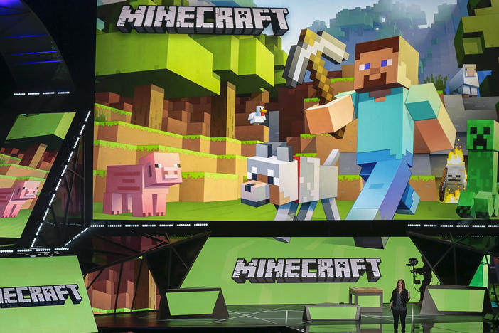 Lydia Winters shows off Microsoft's "Minecraft" ahead of the Electronic Entertainment Expo, in 2015. Cybersecurity experts say Minecraft players were quick to exploit a critical flaw in widely used software that intelligence firms raced to patch Friday.