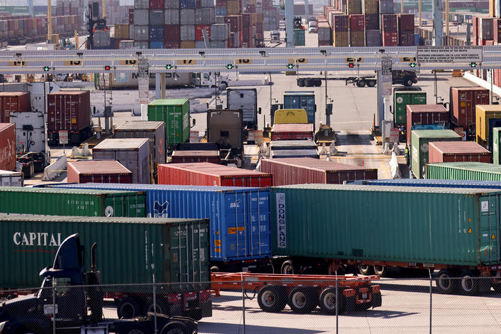 Trucks haul shipping containers at the Port of Los Angeles on Nov. 24, just ahead of the semiofficial start of the holiday season. For much of the country, trucking is the only freight option.