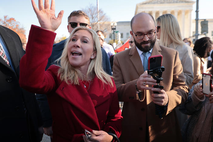 Rep. Marjorie Taylor Greene, R-Ga., joins fellow anti-abortion activists in front of the U.S. Supreme Court on Dec. 1, 2021, as the justices hear arguments on a case about a Mississippi law that bans most abortions after 15 weeks.