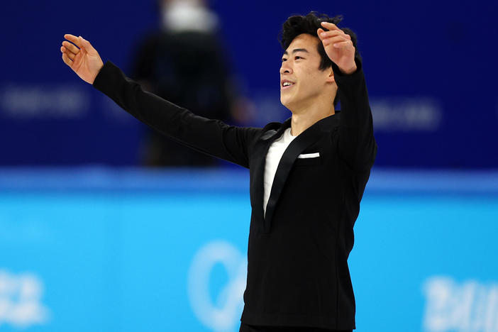 Nathan Chen of the United States wraps his performance in the men's single skating short program team event during the 2022 Winter Olympics at Capital Indoor Stadium on Friday.