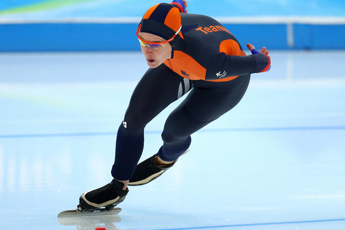 Ireen Wüst of Team Netherlands skates on her way to setting a new Olympic record in the women's 1,500 meters at the Beijing 2022 Winter Olympic Games.