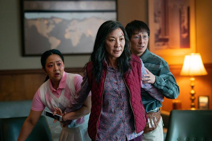 Michelle Yeoh (front), Ke Huy Quan, and Stephanie Hsu in <em>Everything Everywhere All at Once.</em>