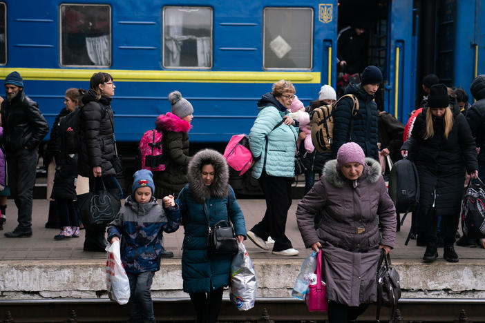 <strong>March 6:</strong> People arrive by train to Lviv, Ukraine.