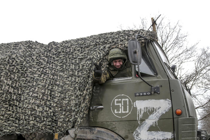 A serviceman waves from a military truck painted with the letter "Z" in Mykolaivka in the Donetsk region, a territory controlled by pro-Russian militants in eastern Ukraine, on Feb. 27.