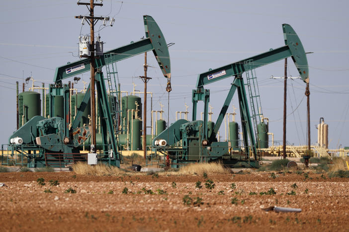A pump jack operating in an oil field in Midland, Texas, July 29, 2020. A Texas law aims to punish investment firms that divest from fossil fuels.