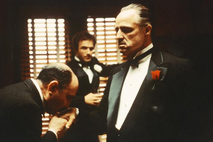 From left to right, Salvatore Corsitto as Bonasera, James Caan as Santino 'Sonny' Corleone and Marlon Brando (1924 - 2004) as Don Vito Corleone in 'The Godfather', 1972. Bonasera asks Don Corleone to avenge the brutal rape of his daughter.