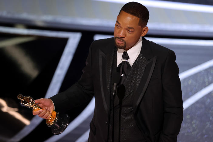 Will Smith accepts the Oscar for best actor in a leading role on Sunday night.