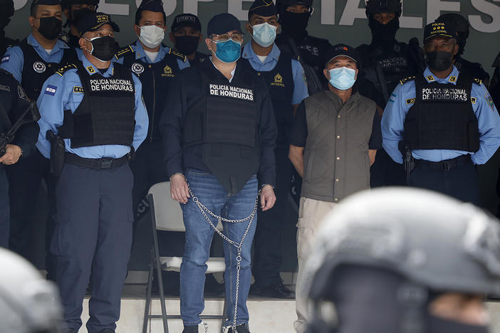 Former Honduran President Juan Orlando Hernández (center in chains), is shown to the press at the Police Headquarters in Tegucigalpa, Honduras, on Feb. 15.