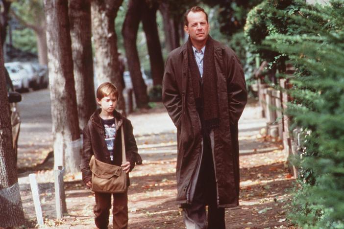 Haley Joel Osment And Bruce Willis in <em>The Sixth Sense</em> in 1999.