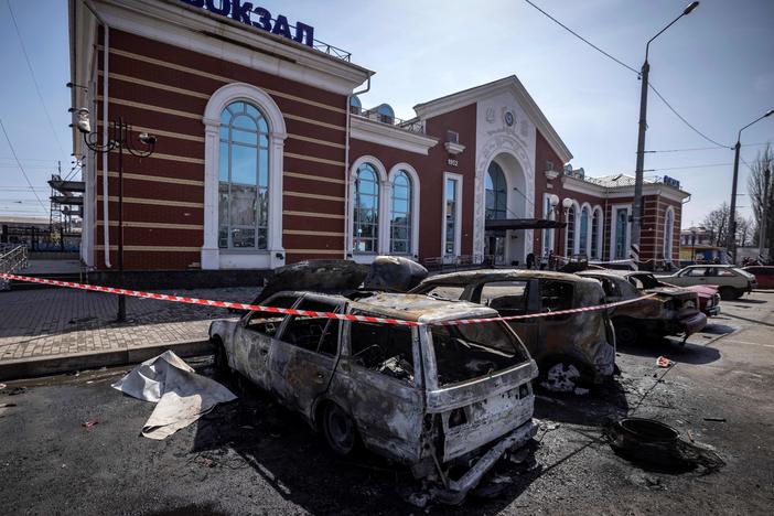 Destroyed cars are seen outside the Kramatorsk train station in eastern Ukraine after a missile strike Friday that killed at least 52 people.