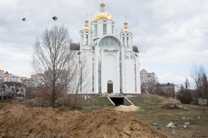 A view of a mass grave by a church on April 4 in Bucha, Ukraine.