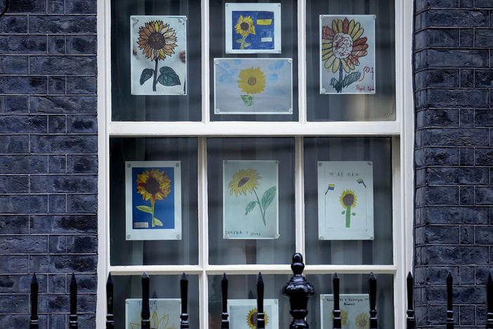 Pictures made by children in solidarity with Ukraine are displayed in a window at 10 Downing Street in London in March.