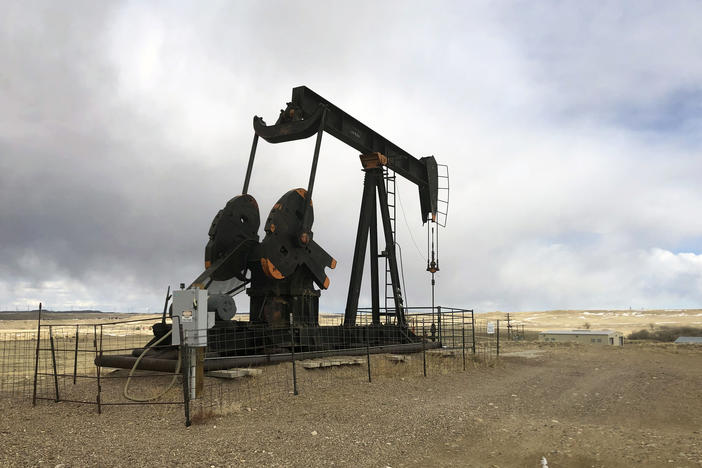 An oil well is seen east of Casper, Wyo., on  Feb. 26, 2021. The Biden administration is raising royalty rates that companies must pay for oil and natural gas extracted from federal lands.