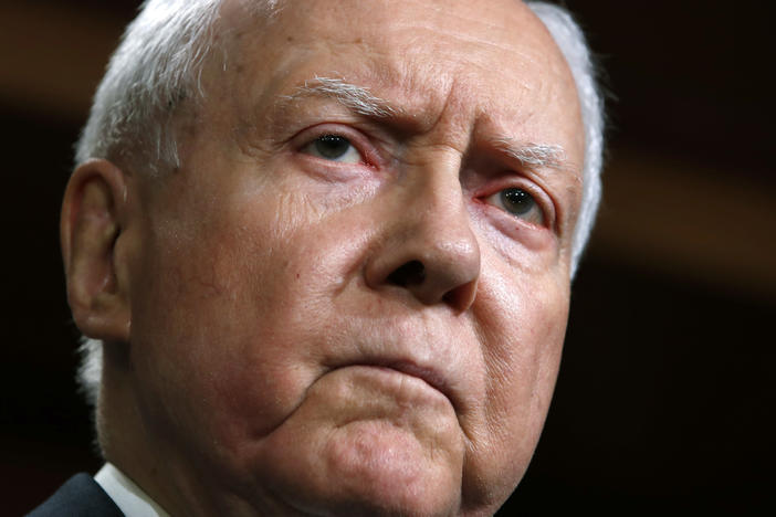 Then Sen. Orrin Hatch, R-Utah, is seen at a news conference with Republican members of the Senate Judiciary Committee on Capitol Hill in 2018. A longtime senator known for working across party lines, Hatch died Saturday at age 88.