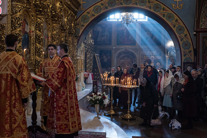 People pray during an Orthodox Easter church service at St. Michael's Golden-Domed Cathedral on Sunday in Kyiv.