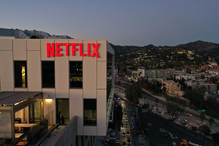 The Netflix logo is seen on top of their office building in Hollywood, Calif. The streaming service has laid off some employees of its companion website called Tudum.
