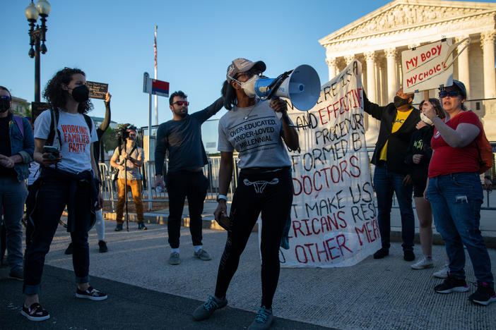 Abortion rights demonstrators chant during a protest outside the Supreme Court on Tuesday.