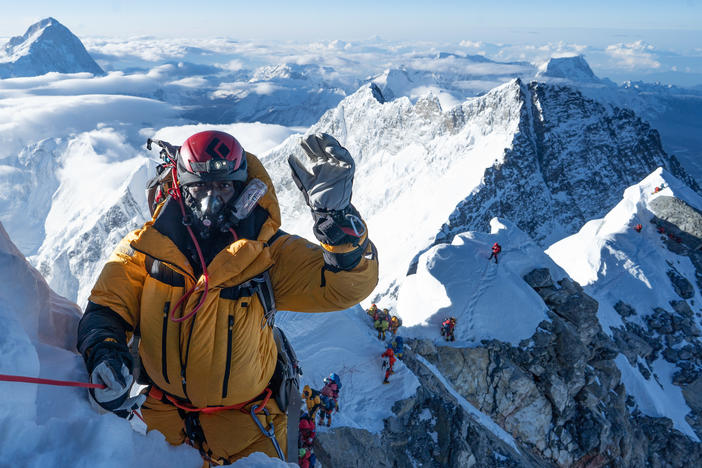 James "KG" Kagambi on Hillary Step on May 12, moments before summiting Mount Everest. He credits the sherpas with helping him and the other climbers stay safe on their journey to the peak.