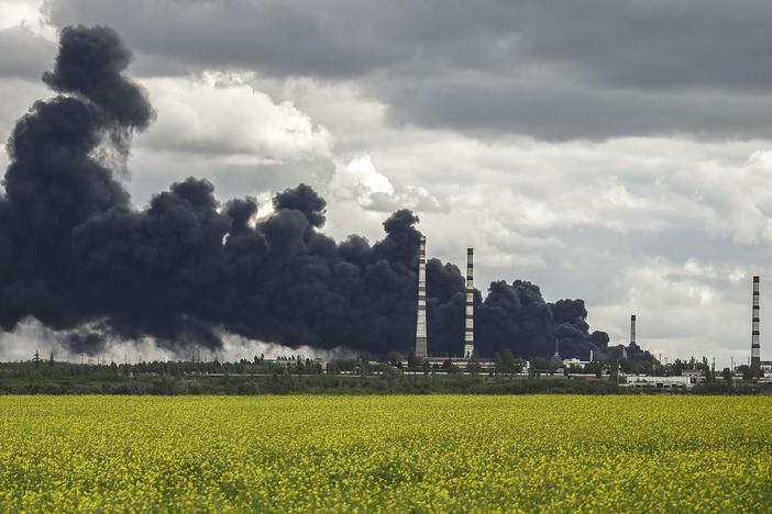 Smoke rises after an attack on an oil refinery in the Donbas region of eastern Ukraine on Sunday.