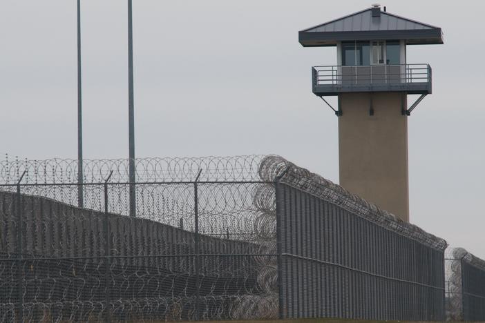 A guard tower and prison yard at the Thomson Correctional Center in Thomson, Ill., in 2009. Five men have been killed at Thomson since 2019, making the facility one of the deadliest federal prisons in the country.