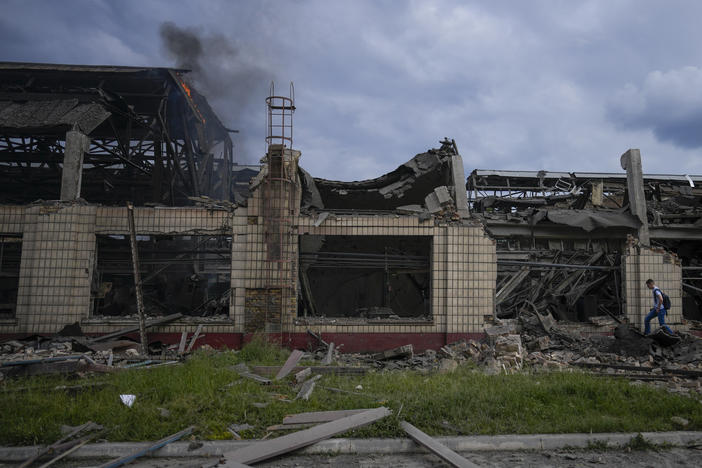 Smokes raises from a railway service facility hit by a Russian missile strike in Kyiv on Sunday.
