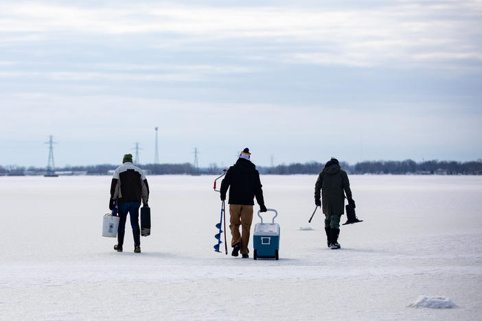 From left: Bowling Green State University emeritus biology professor George Bullerjahn, Bowling Green graduate student Ryan Wagner and University of Windsor professor Mike McKay set out on the frozen surface of Lake Erie's Sandusky Bay to find a spot to collect water samples on Feb. 9 near Port Clinton, Ohio.