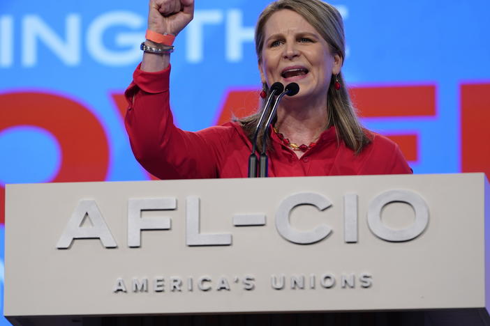 Elizabeth Shuler, president of the AFL-CIO, introduces President Biden before he addresses the labor federation's convention on Tuesday in Philadelphia. On Sunday Shuler was elected to a four-year term as AFL-CIO president.