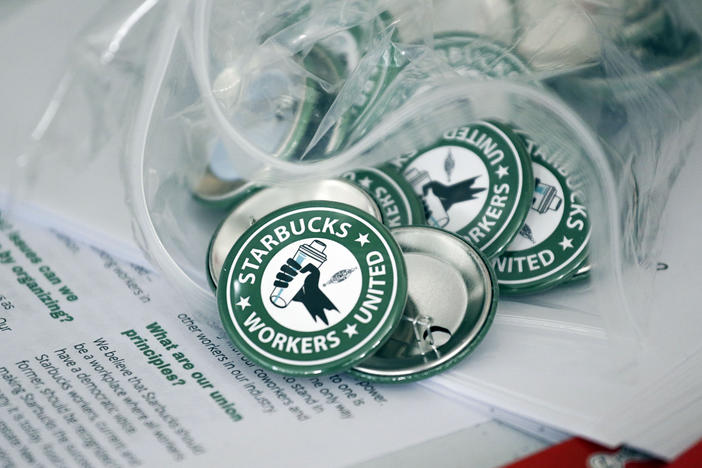 Seven Starbucks workers in Buffalo, N.Y. say they were fired because of their involvement in unionizing. The National Labor Relations Board is asking a court to reinstate them.